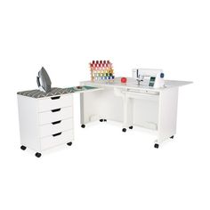 an office desk with two drawers and a sewing machine