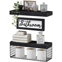 two shelves with towels, toilet paper and other bathroom items on top of each shelf