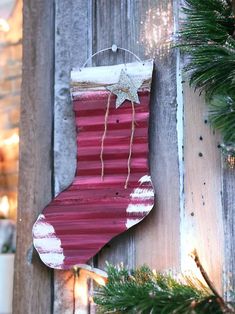 a christmas stocking hanging on the side of a building