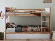 there is a bunk bed with two sets of drawers on the bottom and one side