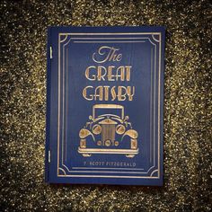 the great gatsby by f scott fitzgerald book cover with gold glitters in the background