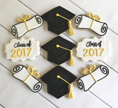 decorated cookies with graduation caps and tassels are arranged in the shape of numbers