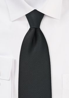 A Matte Black Micro Texture Necktie can be a great accessory to add a touch of sophistication to a variety of formal occasions, including shopping for suits, tuxedos, and men's suits for weddings. When shopping for suits, a matte black micro texture necktie can be paired with a variety of suit colors, such as navy blue, charcoal gray, light gray, or beige. It's a classic and understated choice that can complement any outfit without overpowering it. When shopping for a tuxedo, a matte black micro Suits For A Wedding, Black-tie Suit With Notch Lapel, Elegant Black Black-tie Suit, Dapper Black Semi-formal Ties, Black Semi-formal Ties With Pocket Square, Classic Black Tuxedo, Elegant Adjustable Black-tie Event Ties, Suit Colors, Black Texture