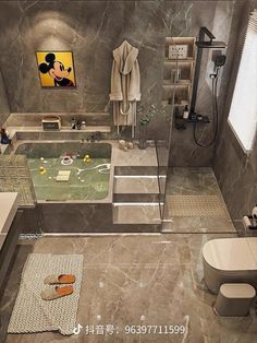 a modern bathroom with marble walls and flooring