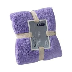 a purple towel with a tag on it