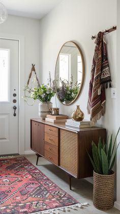 a room with a rug, mirror and plants