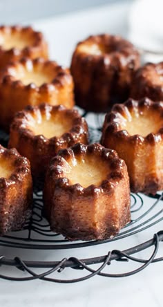 small cakes sitting on top of a wire rack with the words candels recipe with step - by - step photos