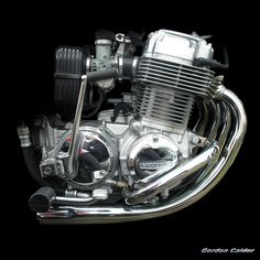 a motorcycle engine is shown on a black background