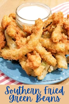 some fried green beans on a blue plate