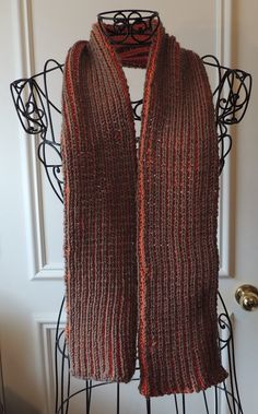 REDUCED PRICE Brioche knit scarf with raised ribs. One side is primarily burnt orange with cocoa brown between the ribs and the other side is the opposite with cocoa brown and brunt orange between the ribs. It is 60 inches long and 6 inches wide.  Handmade by me in my smoke-free, pet-free home.  Hand wash, cold water, do not bleach, lay flat to dry, do not iron. I ship all items in recycled plastic bags to minimize possible damage during shipment.  I ship as soon as possible after payment clears, often the next day, by USPO Priority Mail. Purchase any additional items from my shop for a total purchase of $35, and receive free shipping. Knit Rib Stitch, Brioche Knit, Brioche Knitting, Recycled Plastic Bags, Rib Stitch, Orange Scarf, Brown Scarves, Cocoa Brown, Stitch 2