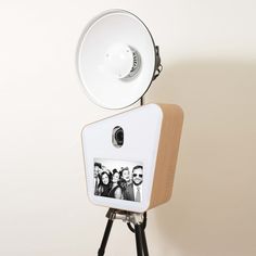 an old fashioned photo is mounted on a tripod