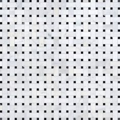 a white and black tiled wall with squares in the middle, as if it were made out of marble