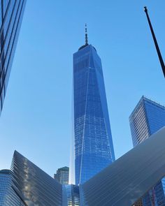 two tall skyscrapers in the middle of a city