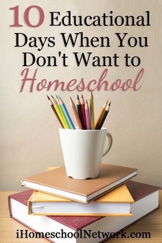 a stack of books and a cup with pencils on top