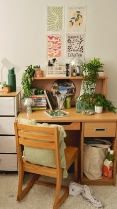 a wooden desk topped with lots of plants