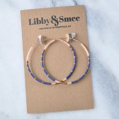 You've asked for a front-to-back hoop version of the beaded Libby & Smee dangle earrings for years and they're finally here. Delicate seed beads — in exclusive Libby & Smee patterns — adorn deluxe gold-filled for a tarnish-resistant style that will last for years. 45mm (about 1.75") gold-filled hoops with tiny glass seed beads packaged on a kraft earring card in a clear resealing bag gold-filled hoops are lead-free gold over brass. Gold-filled has much more gold than gold-plated and will Beads Hoop Earrings, Gold Hoop Beaded Earrings, Gold Beaded Hoop Earrings Gift, Gold Minimalist Hoop Beaded Earrings, Gold Beaded Hoop Earrings For The Beach, Blue Beaded Hoop Earrings Gift, Seed Bead Hoop Earrings, Hoop Earrings Diy, Bead Hoop Earrings