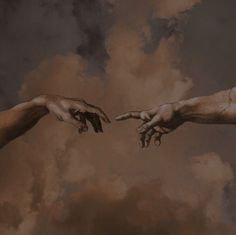 two hands reaching out towards each other with clouds in the background