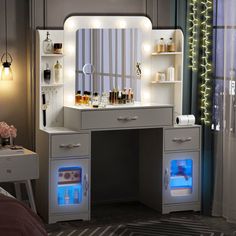 a white vanity with lights on it next to a bed and desk in a room