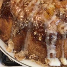 a bundt cake covered in icing on top of a stove