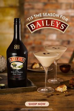 an advertisement for bailey's is shown in front of two glasses and a bottle