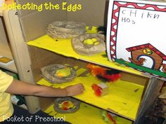 a young boy is making crafts with paper bags and construction materials in the shape of a dog house