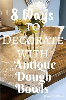 a vase with flowers in it and the words 8 ways to decorate with antique dough bowls