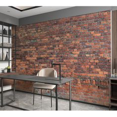 a brick wall in an office with chairs and a desk