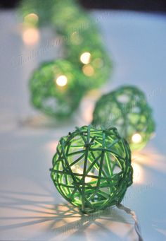 some green string lights on a white table