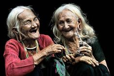 two older women laughing and holding hands with the caption nothing can make you happy