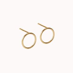 These wonderfully delicate, minimalist stud earrings are made from 14k Gold Filled, 14k Rose Gold Filled, Sterling Silver, Solid 14k Yellow Gold or Solid 14k Rose Gold you can choose upon checkout. They are sold as a pair with matching backings to secure them. All lovingly packaged in a custom gift box. The circles measure about 8mm across and the posts measure 10mm long. We offer three sizes total of this style, this listing being the largest.  You can find the medium size here: https://etsy.me Long Bar Earrings, Circle Stud Earrings, Minimalist Earrings Studs, Minimalist Studs, Circle Earrings Studs, Circle Studs, Minimalist Bracelet, Bar Earrings, Circle Earrings