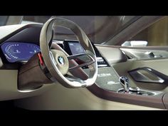 the interior of a modern car with steering wheel and dashboard