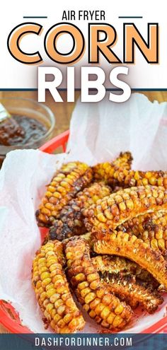 air fryer corn ribs on a red plate with text overlay that says air fryer corn ribs