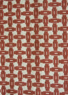 an orange and white pattern on fabric