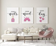 two posters on the wall above a couch in a room with white carpet and pink chairs