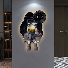 a clock with an astronaut on it in the middle of a room next to a wall