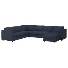 a blue sectional couch with black legs