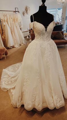 a wedding dress on display in a bridal shop