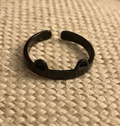 This super cute, black cat ears ring is very cute! It is adjustable a little bit. It's made of alloy. It's a great small accessory to add to any outfit and show your love for your cat! Cheap Rings With Cat Design For Gift, Ring Cat, Black Cat Ring, Silver Cat Design Ring, Novelty Black Jewelry With Cat Design, Cat Ring, Cat Jewelry, Cat Earrings, Small Accessories