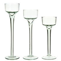 three empty wine glasses sitting next to each other