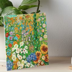 a painting of flowers on a table next to a potted plant art board print