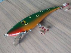 a fishing lure sitting on top of a wooden table