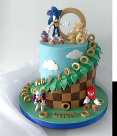 a cake decorated with sonic the hedgehog characters