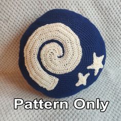 a crocheted blue and white ball with stars on it that says pattern only