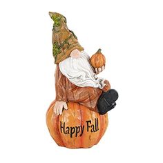 a statue of an old man sitting on top of a pumpkin with happy fall written on it