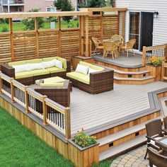 an outdoor deck with furniture on it