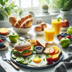 an assortment of breakfast foods on a plate with fruit, eggs, bread and juice