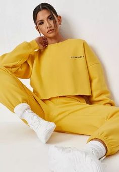 Yellow Relaxed Fit Sweatshirt For Loungewear, Casual Yellow Letter Print Sweater, Casual Yellow Sweater With Letter Print, Yellow Crew Neck Sweatshirt For Loungewear, Sporty Yellow Tops With Ribbed Cuffs, Yellow Sporty Tops With Ribbed Cuffs, Yellow Long Sleeve Sweatshirt Athleisure, Yellow Long Sleeve Sweatshirt In Athleisure Style, Yellow Long Sleeve Sweatshirt For Athleisure