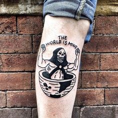 a person with a tattoo on their leg that says the world is mine