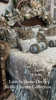 an ornate bed with blue and silver sheets