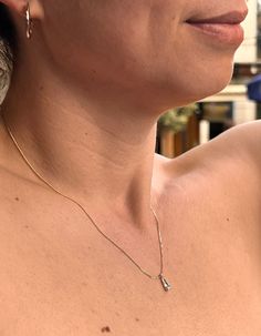 With a very fine droplet at the centre, this dainty necklace has an elegant style that reflects quiet luxury and it is timeless. Perfect for the beach or a hot summer night out. The chain length is 18 inches / 45 cm and the pendant is 2mm. Our products have a very fine particular finish that makes them water and corrosion resistant.  IMPORTANT NOTE; Our jewellery pieces are tarnish resistant and you can wear them in water without any hesitation.  However, we advise you to avoid moisture and wet conditions for long periods, especially water and acidic environments like sea water (saline) or pools (chlorine) and direct application of perfume and cosmetics as these could affect the plating and the colour over time. By keeping them dry and away from corrosive materials and chemicals, you can e Anniversary Pearl Pendant Teardrop Necklace, Anniversary Teardrop Pendant Drop Necklace With Pearl, Anniversary Teardrop Pendant Necklace With Pearl, Dainty Teardrop Necklace With Brilliant Cut, Dainty Teardrop Brilliant Cut Necklace, Classic Teardrop Pearl Pendant Drop Necklace, Classic Teardrop Drop Necklace With Diamond Accents, Dainty Teardrop Necklace With Single Diamond, Dainty Drop Diamond Necklace For Formal Events